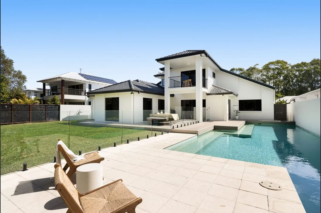 Frameless glass pool fencing panels around a Gold Coast pool